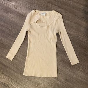 Long sleeve shirt with cut out in front.
